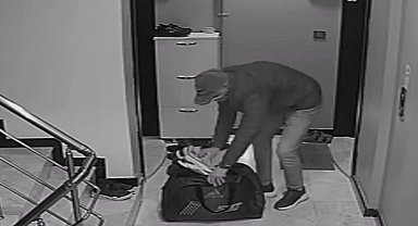İzmir'de apartmanlara girip beğendiği ayakkabıları valize koyan hırsız yakalandı