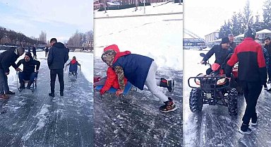 Yüzeyi buz tutan nehrin üzerinde kızak keyfi yaşadılar