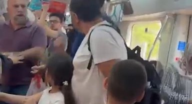Marmaray'da çocuklarının yanında babaya yumruk