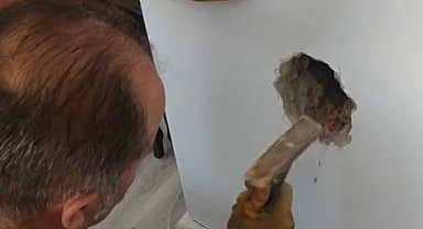 Bacada mahsur kalan kediyi itfaiye ekipleri kurtardı