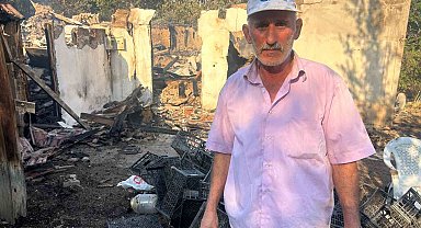 Evini yanmaktan su hortumu ile kurtardı