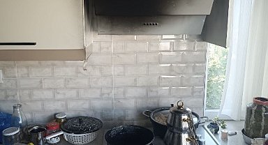Manyas'ta apartman dairesinin mutfağında yangın çıktı