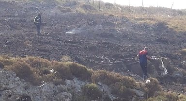 Sinop'ta çalılık alanda çıkan yangında kalan bir kadın, itfaiye ekiplerince kurtarıldı