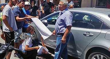 Vatandaşlar yaralı kadın sürücüyü güneşten havluyla korudu