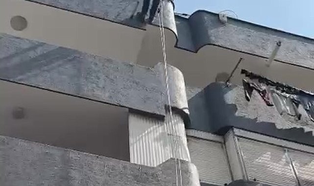 Adana'da balkon filesine sıkışan güvercin kurtarıldı
