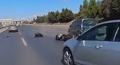 Arnavutköy'de motosikletli, araç altında kalmaktan son anda kurtuldu