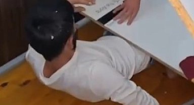 Aranan şahıs yatağın altında yakalandı