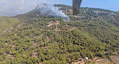 Kemer'de ormanlık alanda çıkan yangına havadan ve karadan müdahale
