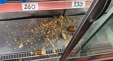 Erzurum'da iş yerinde korkutan anlar, Dolapta donan şişe patladı