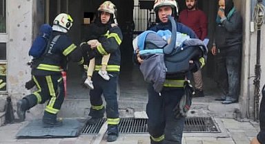 Ev olarak kullanılan iş hanında çıkan yangında 17'si çocuk 21 kişi kurtarıldı