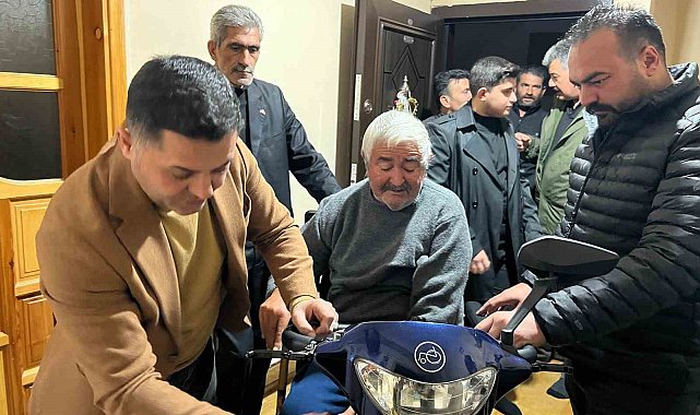 Kars MHP'den engelli vatandaşa akülü araç desteği