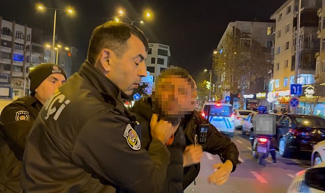 Tartıştığı gencin başında içki şişesini kırdı