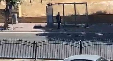 Durakta bekleyen eşini silahla vurdu