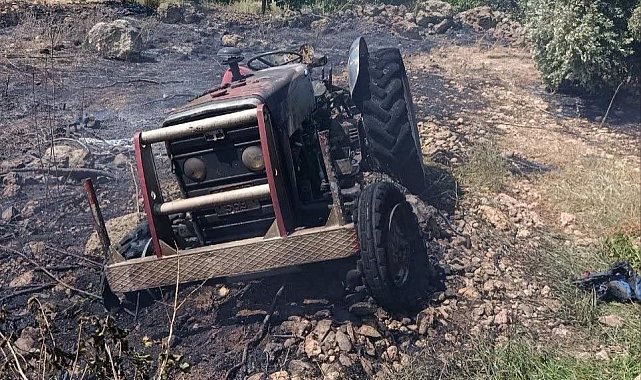 Erzin'de otluk alanda çıkan yangında alevler traktöre sıçradı