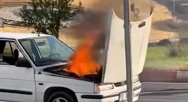 Siirt'te seyir halindeki otomobil alev aldı, yangını belediye otobüs şoförü söndürdü