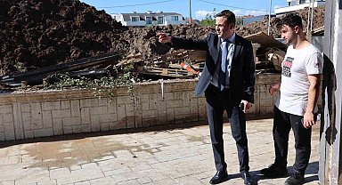 Başkan Özlü'den selzede esnafa destek