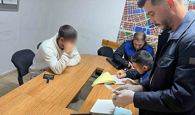 Yalan söyleyerek tramvayda para toplayan dilenciye zabıta engeli